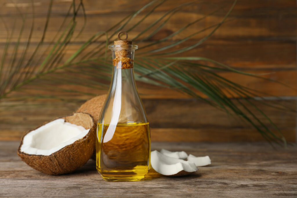 Composition With Coconut Oil On Wooden Table. Healthy Cooking